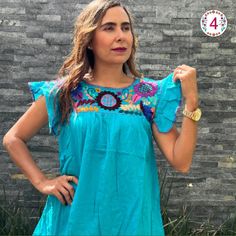 This feminine vintage style shirt is beautifully made. Colorful flowers, it is a unique one of a kind. Since it is hand embroidered, each flower is slightly different. It is made of cotton and it extremely comfortable. Beautiful Blouse, made with 100% cotton blanket, dyed in bright colors. The ruffles that distinguish this blouse are made by hand, by artisans from Chiapas. Beautiful blouse, you can use it with jeans, leggings, skirts, it is a very elegant blouse and has a beautiful and fine embroidery About Our Items: Each one of our items are handmade/hand woven by Indigenous communities of Chiapas and Oaxaca in Mexico. Great care has been taken to ensure the quality of uniqueness of each item we sell.  Our items are made of cotton. Each flower on each item will be a bit different as they Bohemian Shirt With Multicolor Embroidery, Casual Embroidered Short Sleeve Top, Traditional Blue Summer Shirt, Bohemian Embroidered Hem Short Sleeve Top, Blue Folk Style Short Sleeve Blouse, Blue Short Sleeve Folk Blouse, Festival Tops With Embroidered Hem, Festival Embroidered Top With Hem Detail, Traditional Blue Shirt For Summer