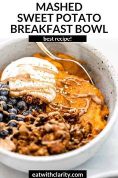 a bowl filled with mashed sweet potato and blueberries