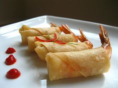 some food is on a white plate with ketchup