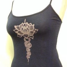 a women's tank top with an intricate design on it