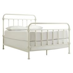 a white metal bed frame with two pillows