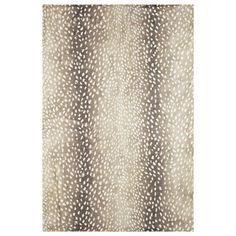 an animal print rug with white and brown spots