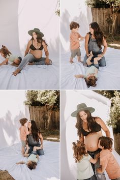 a woman and two children are sitting on the ground