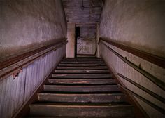 an old set of stairs leading up to the second floor