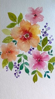 watercolor flowers on white paper with green leaves