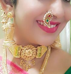 Elevate your traditional Maharashtrian look with our exquisite 💛 Gold Plated Clip Nath - a stunning piece of Indian jewelry that effortlessly captures the essence of cultural richness. Designed for both pierced and non-pierced noses, this versatile Clip On Nose Ring adds a touch of elegance without the need for piercing. ✨ Crafted with precision and care, our High-Quality gold plated Clip Nath boasts intricate detailing, mimicking the opulence of real gold. The left-side orientation ensures aut Traditional Bridal Sets With Tilla For Marriage, Traditional Jewelry With Latkans For Marriage, Traditional Latkans Jewelry For Marriage, Traditional Bridal Sets For Marriage, Tilla Jewelry For Marriage And Festivals, Traditional Jewelry With Intricate Design For Marriage, Traditional Rings With Intricate Design For Festivals, Traditional Jewelry For Marriage With Intricate Design, Tilla Rings For Wedding And Festivals