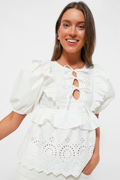 Exclusive White Ruffle Eyelet Top Flirty Ruffled Blouse For Brunch, Flirty Ruffle Hem Tops For Day Out, Flirty Short Sleeve Blouse With Ruffles, Flirty Ruffled Blouse For Day Out, Flirty Short Sleeve Blouse For Brunch, Flirty Ruffled Tops For Day Out, Feminine White Eyelet Tops, Flirty White Ruffled Tops, White Feminine Eyelet Top