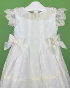 Made in Spain Dry Clean 50% Cotton, 50% Polyester Final sale, no exchanges nor returns are available Elegant Baptism Dress For Spring, Off White Lace Trim Dress For Garden Party, Elegant Summer Baptism Dress For Garden Party, White Baptism Dress For Spring Garden Party, Elegant Cream Baptism Dress For Summer, White Lace Trim Dress For Garden Party, Elegant White Baptism Dress For Spring, Classic Summer Dresses With Lace Trim, Elegant Off-white Summer Baptism Dress