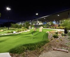 a golf course at night with lights on