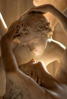 a statue with the words being deeply loved by someone gives you strength while loving someone deeply gives you courage