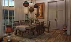 a large dining room table and chairs in front of a window