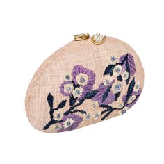 a pink purse with purple flowers on it