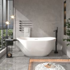 a large white bath tub sitting next to a window