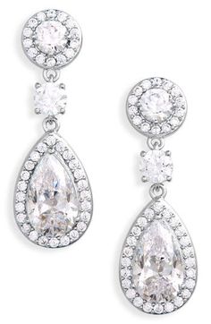 Pavé trim adds a shimmering border to these rhodium-plated sterling silver drop earrings host to a stunning mix of cubic zirconia. 1" drop; 3/8" width Post back Cubic zirconia/sterling silver/rhodium plate Imported Classic Drop Chandelier Earrings With Diamond Accents, Formal Bridal Earrings With Pave Setting, Brilliant Cut Teardrop Chandelier Earrings With Cubic Zirconia, Teardrop Chandelier Earrings In Cubic Zirconia With Brilliant Cut, Silver Dazzling Cubic Zirconia Chandelier Earrings, Cubic Zirconia Brilliant Cut Dangle Earrings, Cubic Zirconia Dangle Linear Earrings In Brilliant Cut, Dazzling Silver Chandelier Earrings With Cubic Zirconia, Dazzling Silver Cubic Zirconia Chandelier Earrings