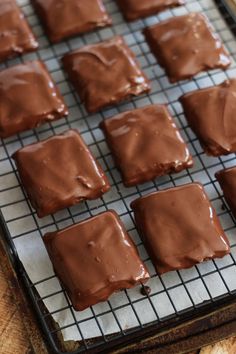 chocolate frosted squares on a cooling rack ready to go into the oven for baking