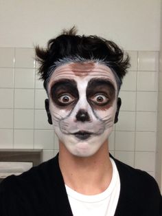 a man with his face painted white and black