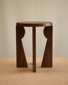 a wooden table sitting on top of a hard wood floor