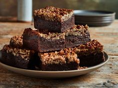 several brownies stacked on top of each other on a plate