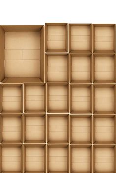 an open cardboard box with many compartments on the bottom and sides, all lined up in rows