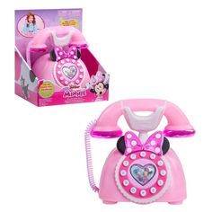 Call a friend for a great chat on the Disney Junior Minnie Mouse Ring Me Rotary Phone. This delightful kids’ toy is full of roleplay fun. It looks just like the phone Minnie Mouse uses on the Disney Junior animated hit, Minnie’s Bow-Toons. With stylish details, this retro-inspired pretend play phone features a super luxe, iridescent pink finish with chrome-like accents, and buttons that activate lights, fun phone sound effects, and Minnie Mouse phrases. Adorable mouse ears and a polka dot bow ma Toy Telephone, Toy Shopping Cart, Play Phone, Mouse Ring, Disney Cheap, Minnie Mouse Toys, Disney Jr, Rotary Phone, Mouse Toy