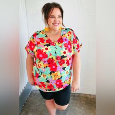 This Stunning Multicolor Tropical Floral Print Top Designed With Banded Short Sleeves And A Casual V Neck Will Add Charm To Any Outfit. Banded Sleeves + V Neck + Tropical Floral Print Stretch 95% Polyester 5% Spandex Designed In California Imported Runs Loose Weight: .4 Lbs; Plus .5 Lbs Bust (Side Seam To Side Seam): S 23" M 24" L 25" 1x 27" 2x 28" 3x 29" Length (Shoulder To Hem): S 27" M 27.5" L 28" 1x 30" 2x 30.5" 3x 31" Regular Model Measurements: 5' 7", Size Small, Chest 32", Waist 26", Hips Bold Red Tops For Spring, Fun Red Spring Top, Fun Multicolor Spring Blouse, Trendy V-neck Tropical Print Top, Long Black Blouse, Beachwear V-neck Tops With Tropical Print, Green V-neck Top With Vibrant Print, Mustard Yellow Blouse, Vibrant Print Multicolor V-neck Top