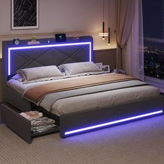 a bed that has some lights on the headboard and night stands in front of it