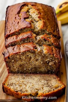 a loaf of banana nut bread on a cutting board