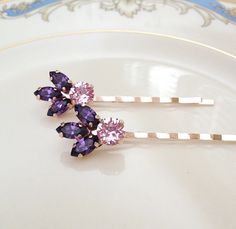 Gorgeous pair of hair pins featuring crystals in 2 shades of purple. Hair pins are 3 inches long, including. Rose gold metal finish. The Swarovski crystal part is 1 inch long. Hair Accessories Bridesmaid, Crystal Cluster Earrings, Swarovski Crystal Drop Earrings, Crystal Teardrop Earrings, Crystal Hair Pins, Eggplant Purple, Wedding Hair Pins, Purple Crystal, Rose Gold Metal