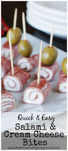 small appetizers with olives are arranged on a plate