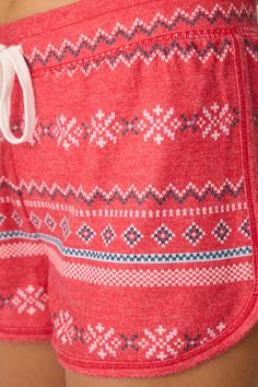 Perfect for warmer nights or layering up, these red PJ shorts with a tie waist are adorned with a holiday Fair Isle pattern, bringing a merry and bright touch to your loungewear. Cozy up by the fire or unwrap gifts in comfort and festive style! Pj Shorts, Holiday Patterns, Fair Isle Pattern, Sleepwear & Loungewear, Pj Sets, The Fire, Egift Card, Merry And Bright, Fair Isle