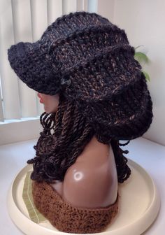 This is a handmade, crocheted, professionally finished Large XL Tam Mushroom Hat ► ITEM DESCRIPTION ITEM NAME: Black & Brown Wool XL Newsboy hat ( Video shows the tam without a brim, that version is called Burgundy XL Bloom and will be on another listing )  ♦ Brim is structured to hold it's shape ♦ Has a soft, satin smooth inner band where the drawstring sits to protect your hair edges ♦ Made of a premium wool / acrylic blend yarn ♦ Inner drawstring on the inside so it has a custom, snug, stretch-proof fit.  ♦ This hat has stretch to allow fitting for larger heads ( also good if you have braids, dreadlocks, and thicker hair)  ► MATERIALS Made of a premium wool / acrylic blend yarn ► CARE INSTRUCTIONS ♦ Hand wash and Air dry ► CUSTOM OPTIONS ♦ If you would like custom options not shown in t Hair Edges, Mushroom Hat, Newsboy Hat, News Boy Hat, Big Party, Black Hat, Base Colour, Thick Hair Styles, Black And Brown