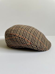 100% wool plaid classic Ascot shape hat.  Made in England. Men's size medium (about 21 1/2 in.) Excellent vintage condition. Fitted Wool Flat Cap, Classic Tweed Flat Cap, Classic Wool Hat, Classic Tweed Cap, Vintage Flat Bill Hat For Fall, Classic Brown Flat Cap, Brown Wool Flat Cap, Vintage Wool Flat Cap, Formal Wool Flat Cap