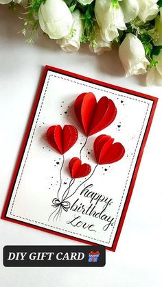 a card with some red hearts on it