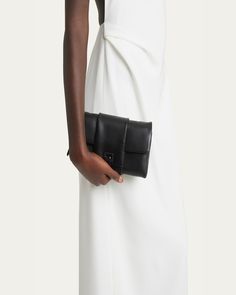 Proenza Schouler shoulder bag in napa leather     Shoulder strap, 8.1"L    Center flap buckle strap    Interior, one zip pocket     Lining: Cotton    Approx. 4.9"H x 8.5"W x 2.2"D    Made in Italy Zip Pouch, Proenza Schouler, Leather Shoulder Bag, Zip Pockets, Shoulder Strap, Tops Designs, In Italy, Pouch, Shoulder Bag