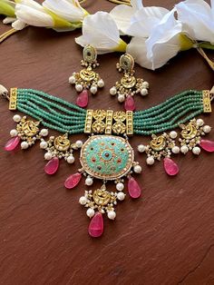 Elegant and delicate Indian Necklace With Gold Plating. Indian Bridal Kundan set One Gram Jewelry Choker Set. Very Gorgeous and pretty, fine Kundan choker necklace with matching earrings Adjustable length with help of dori (cord) Ready to ship from NJ, United States Kundan Jewelry With Motifs For Eid, Bohemian Kundan Choker For Diwali, Festive Meenakari Choker Necklace, Traditional Green Jewelry With Motifs, Round Meenakari Necklaces For Eid, Meenakari Necklaces For Eid, Traditional Kundan Choker Necklace With Intricate Design, Bohemian Kundan Choker Necklace, Traditional Kundan Choker With Intricate Design