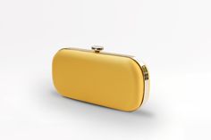 The Limoncello Yellow Bella Clutch is a bold yellow bridal handbag, crafted with duchess satin by Italian artisans featuring a lively pop of color. Planning a maximalist wedding day or looking to make a powerful statement at your next gala? Inspired by Italy’s Amalfi Coast, a coastline featuring terraced vineyards and cliffside lemon groves, this luxury handbag will make a statement on your wedding day, at a red-carpet affair, or on a tropical destination trip. First seen on celebrity stylist Mi Modern Yellow Evening Bags, Modern Yellow Evening Bag, Yellow Clutch Bag For Party, Chic Yellow Rectangular Clutch, Classic Yellow Evening Bag, Chic Yellow Clutch For Formal Occasions, Chic Yellow Clutch For Gift, Chic Yellow Clutch As Gift, Chic Yellow Clutch As A Gift