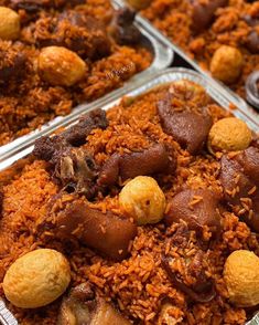 three trays filled with different types of food on top of each other in metal pans