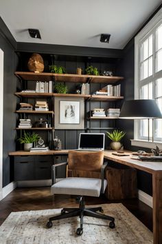 a home office with black walls and wooden shelves