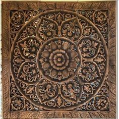 an intricately carved wooden wall panel