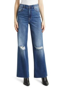 A modern take on classic '90s jeans, this roomy pair adds drama to your look with ripped knees, raw hems and stretch-kissed denim. Zip fly with button closure Five-pocket style 93% cotton, 5% polyester, 2% spandex Machine wash, tumble dry Imported Edgy Denim Flare Jeans With Frayed Hem, Edgy Mid-rise Flare Jeans With Frayed Hem, Edgy High Rise Flare Jeans In Medium Wash, Edgy High Rise Medium Wash Flare Jeans, Edgy Wide Leg Jeans With Frayed Hem, Edgy High Rise Relaxed Fit Jeans, Edgy High-rise Relaxed Fit Jeans, Edgy Relaxed Fit Cutoff Jeans, Edgy High Rise Relaxed Fit Flare Jeans