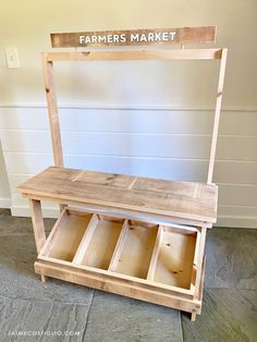 a bench made out of wood with the words farmer's market written on it