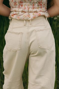 Upgrade your wardrobe with our Brayden Barrel Denim-Natural pants! The wide leg and relaxed fit provide comfort and style, while the tan seam details add a touch of uniqueness. These pants are perfect for any occasion, but be aware - they do run on the shorter side. Grab a pair today and elevate your look! *Relaxed fit, runs a bit big* Material Content: 98% Cotton // 2% Spandex Material Pattern: Solid Bryn is 5’1” and wearing a small Model Measurements: Bryn: Height: 5’1” // Chest: 30” // Waist: Cream Cotton Flare Jeans For Fall, Neutral Cotton Bottoms With Five Pockets, Casual Neutral Jeans With Five Pockets, Beige Cropped Leg Wide Pants In Cotton, Beige Cropped Wide Leg Cotton Pants, Chic Beige High-waist Flare Jeans, Chic High Waist Beige Flare Jeans, Beige Cotton Cropped Wide Leg Pants, Beige Wide Leg Cropped Pants With Pockets