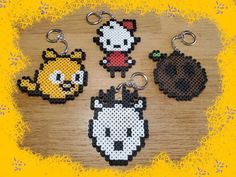 four perler keychains with different designs on them