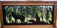 the silhouettes of animals are on display in front of trees