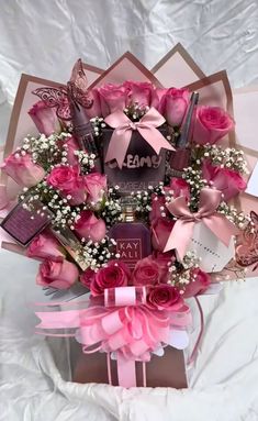 a bouquet of pink roses in a gift box