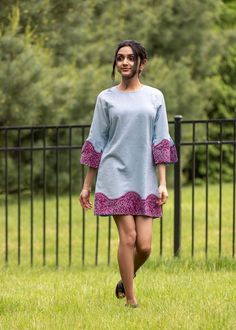 Strewn Leaves Dress Turn heads in this one-of-a-kind addition to your collection. This sky-blue dress features magenta block-printed leaves around the hem and ¾ length bell sleeves, perfect for any occasion.  Sustainably made in Jaipur.  Materials: 100% cotton flax Washing instructions: Hand wash and line dry only.  Sizing: Garment Measurement in Inches Strewn Leaves Dress   SizeShoulderChestSleeve Length  XS    12          34            18     32 S    13          34            18     32 M    13          36            19     33 L    14          38            19     32 XL    14.5          42           20     32   In stock and ready to ship. Bohemian Shift Dress For Party, Blue Cotton Shift Dress, Spring Fitted Tunic Dress, Fitted Tunic Dress For Spring, Fitted Tunic Dress For Day Out, Chic Cotton Tunic Dress, Fitted Tunic Mini Dress For Spring, Spring Party Tunic Mini Dress, Spring Tunic Mini Dress For Party