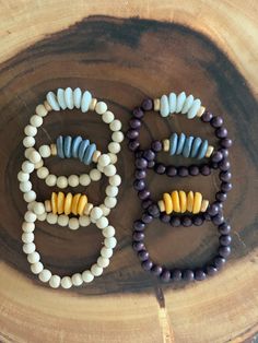 "I love adding in a little something different to my bracelet stacks! These are perfect for that!  This listing is for ONE wooden beaded bracelet with Ashanti glass beads in mustard, slate, or dark purple. The two wood tone choices are natural or dark chocolate brown. (Only one available for each at this time) Wear alone, wear multiples, or add to another stack for a fun combination! The possibilities for this chunky neutral bracelet are endless!   The bracelets are 7\", which fits average adult Bohemian Stretch Bracelet With Large Beads For Everyday, Bohemian Wooden Beads Stretch Bracelet For Meditation, Bohemian Brown Stretch Bracelet With Large Beads, Rustic Wooden Beads Bracelet, Unique Wooden Beaded Bracelets For Healing, Bohemian Stretch Bracelet With 8mm Beads For Everyday, Bohemian Bracelet With Round Wooden Beads, Unique Wooden Beads Bracelet For Healing, Bohemian Wooden Beads Stretch Bracelet