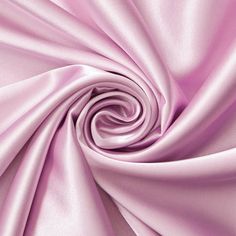 a close up view of a pink satin fabric