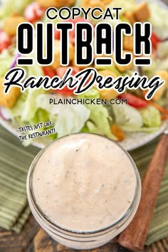 a salad with ranch dressing in a glass jar