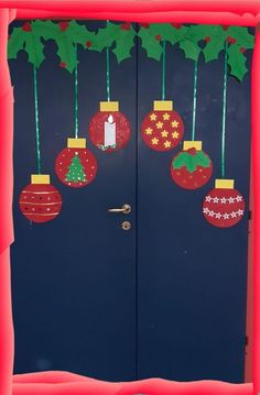 the door is decorated with christmas ornaments